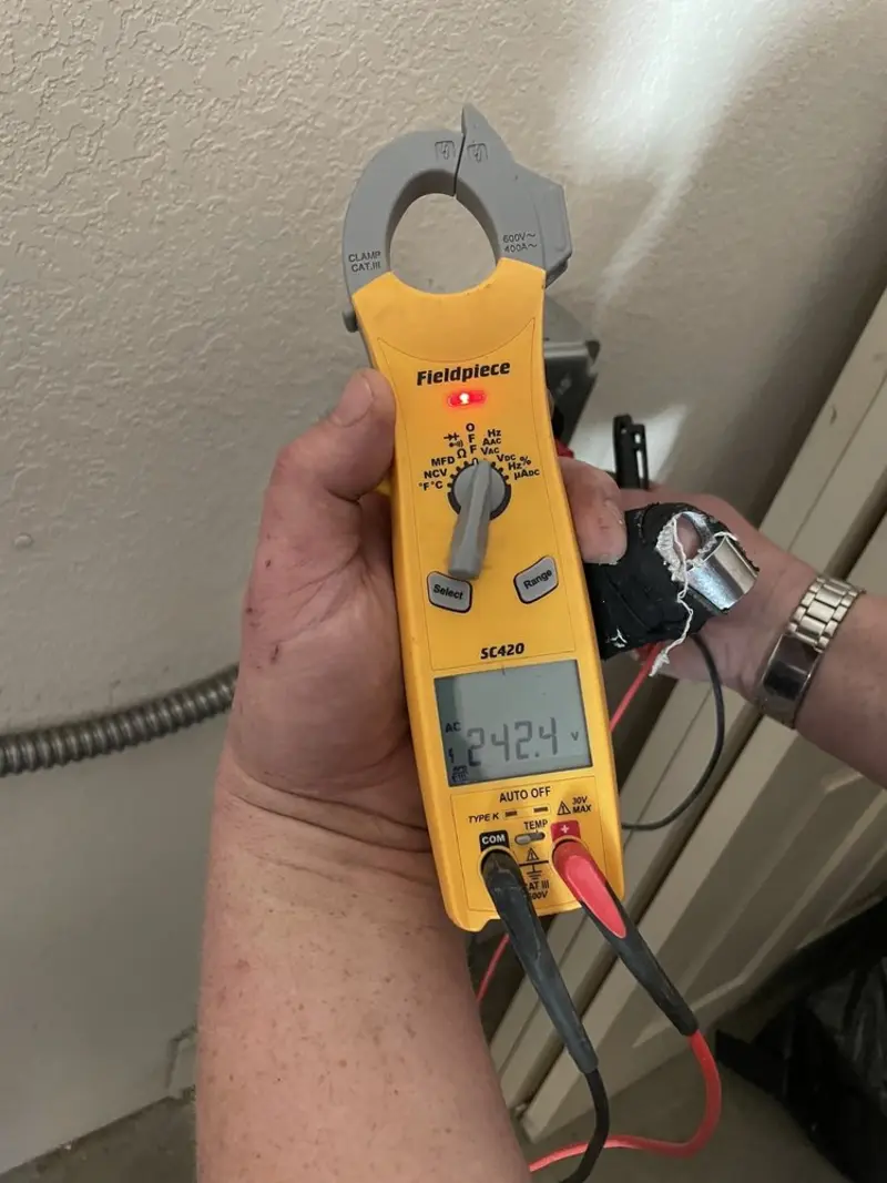 Voltage testing with clamp meter during Electrical Installation Services in El Paso